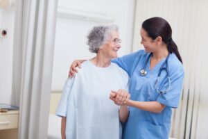 Nurse assisting elderly